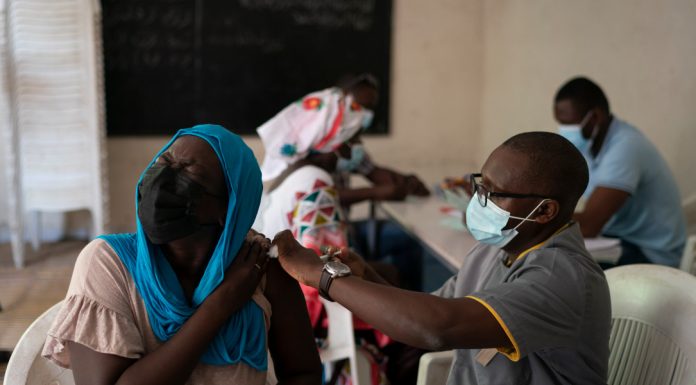 Stop giving out booster shots until more of the world is vaccinated, says the WHO